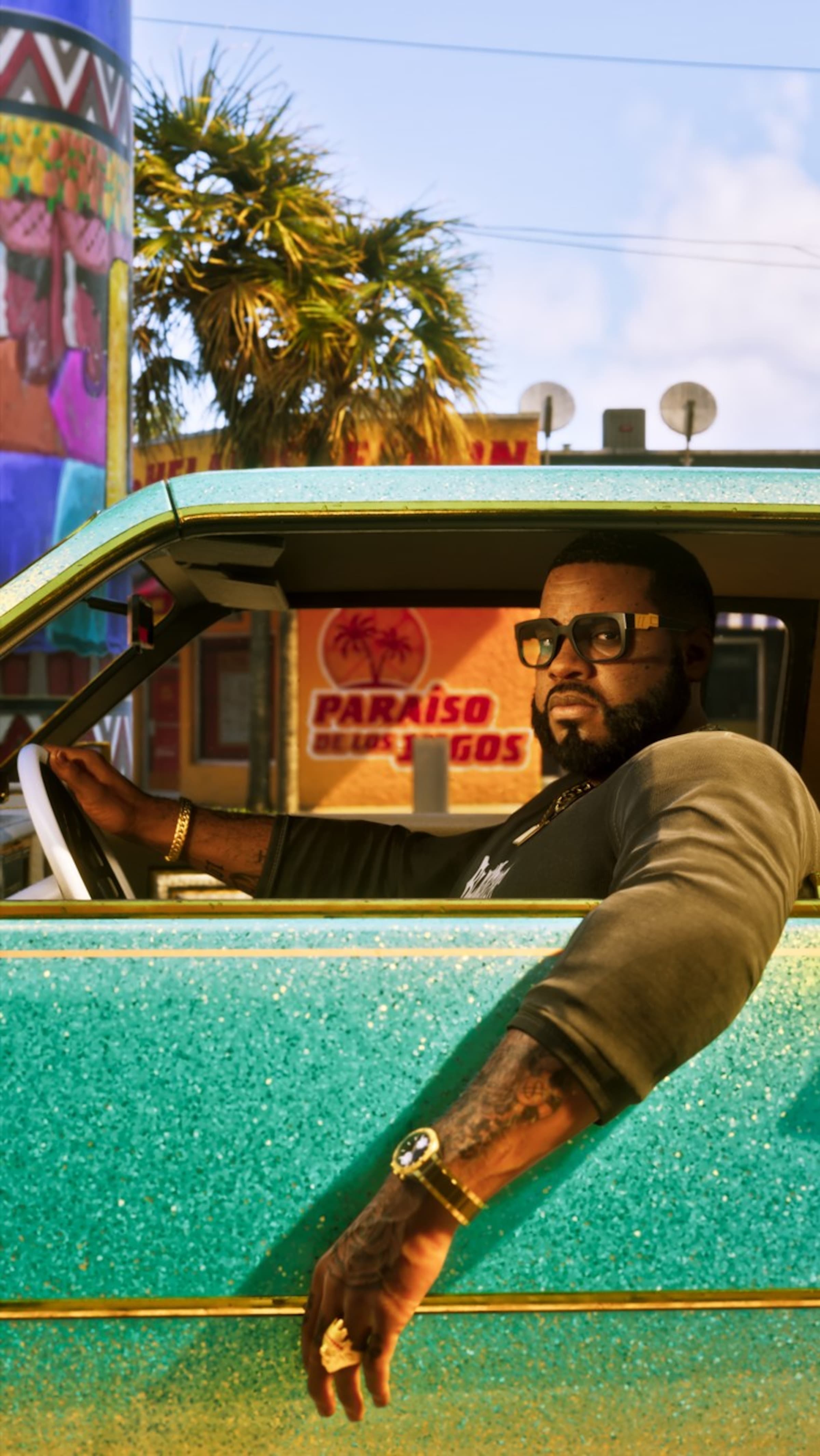 Boobie Ike behind the wheel of a turquoise flake lowrider on a Vice City street