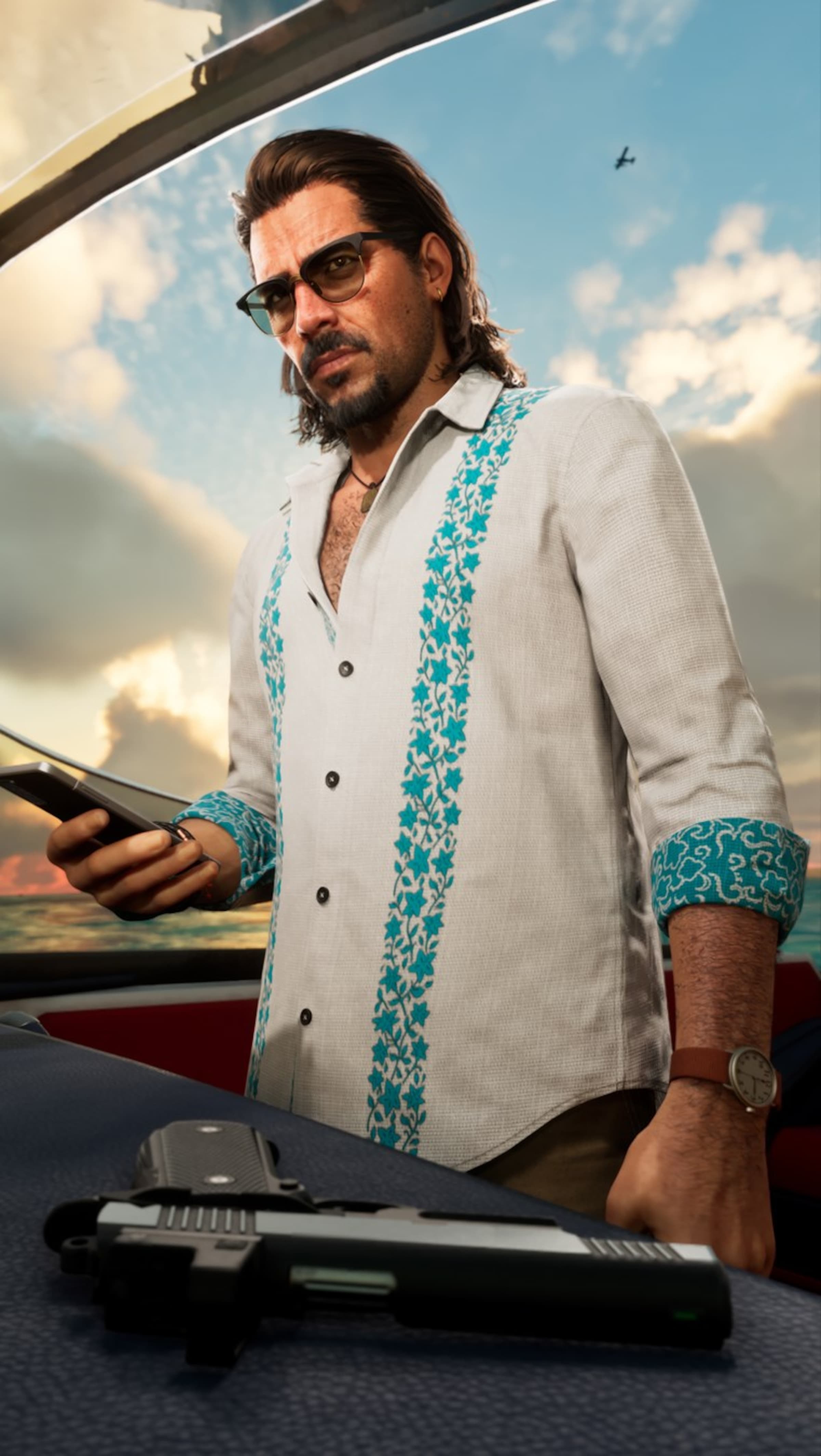 Raul Bautista on a speedboat at sunset holding a phone with a pistol on the dash