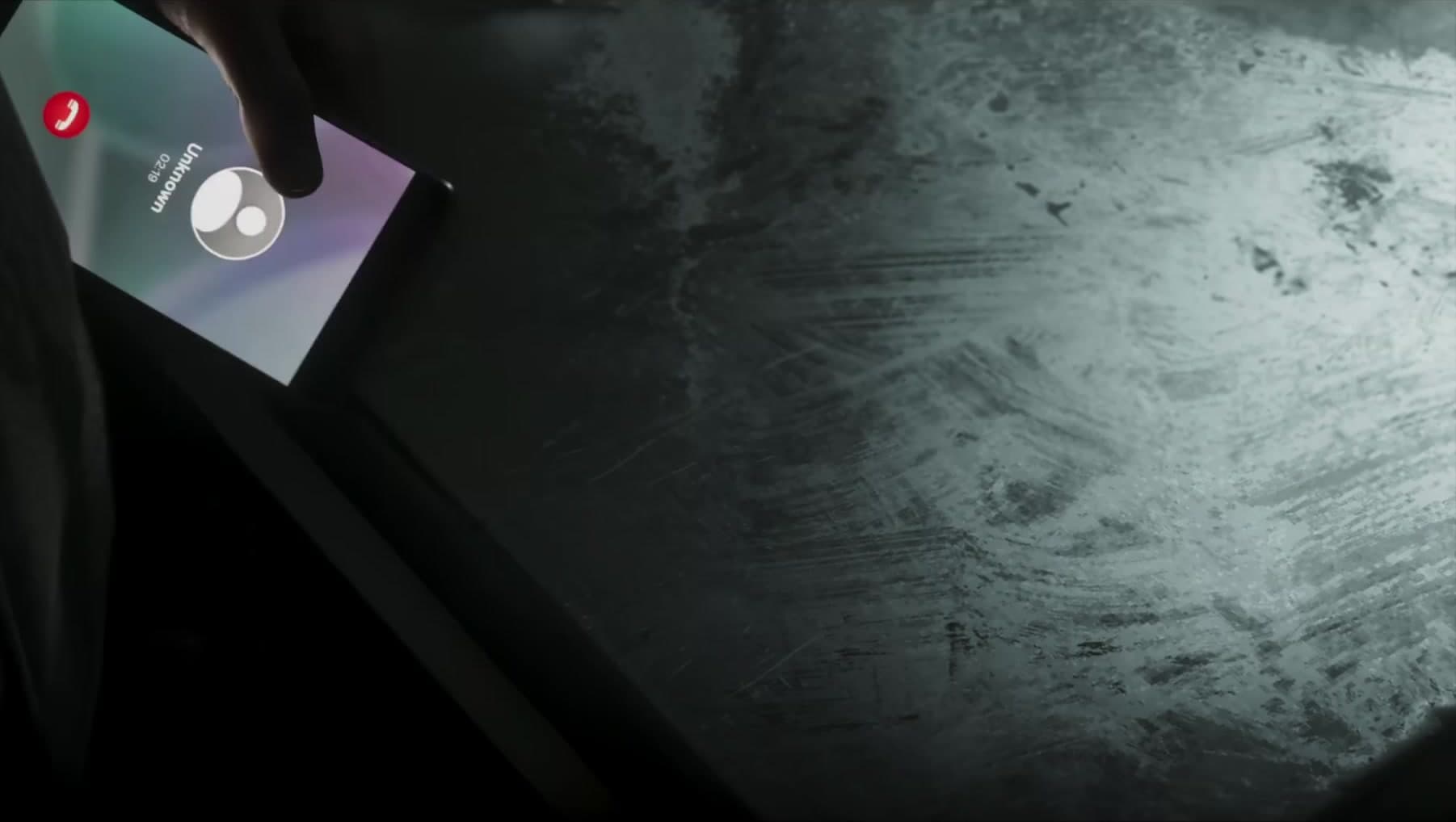 An incoming call from Unknown at 2:19am on a phone above the powder table