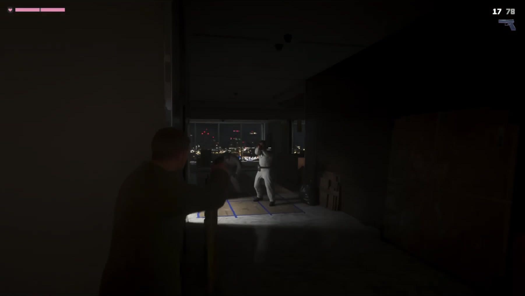 Jason and a coverall raider aim at each other across the taped renovation floor